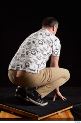 Whole Body Man White Shirt Trousers Chubby Kneeling Studio photo references